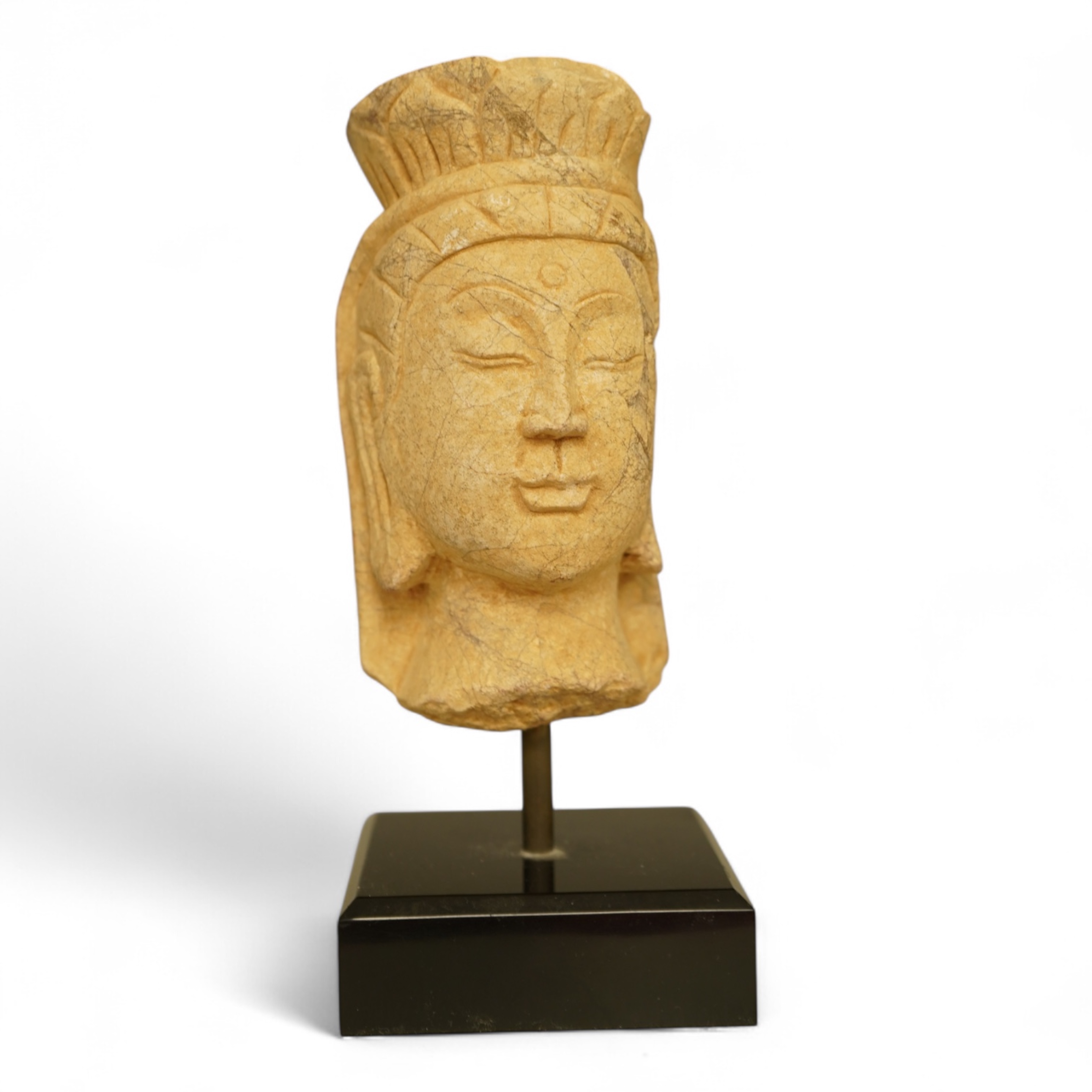 A composition bust of Bodhisattva, possibly Tibetan, on stand, 18cm high